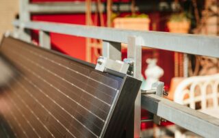 Solar panel being installed on a metal frame.