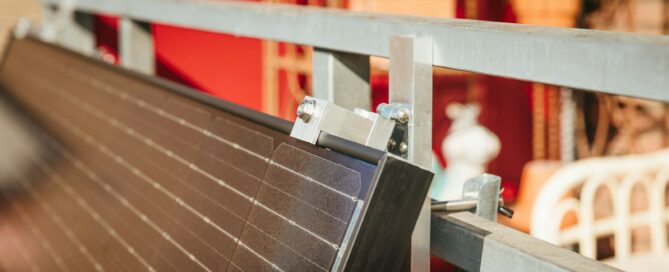 Solar panel being installed on a metal frame.